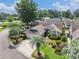 Beautiful home featuring lush landscaping, a circular driveway, and mature palm trees at 4703 Bermuda Way, Myrtle Beach, SC 29577
