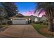 Charming front exterior with a well-kept lawn and inviting curb appeal at dusk at 4703 Bermuda Way, Myrtle Beach, SC 29577