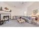 Cozy living room featuring a fireplace, neutral carpeting, and a comfortable patterned sofa at 4703 Bermuda Way, Myrtle Beach, SC 29577