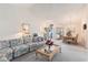 Bright living room featuring vaulted ceilings, neutral carpet, and a large sofa, perfect for gatherings at 4703 Bermuda Way, Myrtle Beach, SC 29577