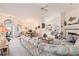 Open-concept living room featuring vaulted ceilings, a fireplace, and views into the dining area and kitchen at 4703 Bermuda Way, Myrtle Beach, SC 29577