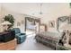 Inviting main bedroom features a ceiling fan, a private patio entrance, and natural light at 4703 Bermuda Way, Myrtle Beach, SC 29577