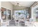 Inviting sunroom features floral sofa and chairs, providing a bright, relaxing space at 4703 Bermuda Way, Myrtle Beach, SC 29577