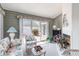 Sunroom with sliding glass doors, comfortable seating, and natural light at 4703 Bermuda Way, Myrtle Beach, SC 29577