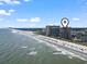 Beautiful aerial view of the beach, ocean, and nearby buildings at 4800 S Ocean Blvd. # 1008, North Myrtle Beach, SC 29582