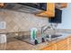 Close-up of a kitchenette featuring granite counters and modern appliances at 4800 S Ocean Blvd. # 1008, North Myrtle Beach, SC 29582