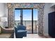 Cozy living room with comfortable seating and a stunning view of the ocean from the balcony at 4800 S Ocean Blvd. # 1008, North Myrtle Beach, SC 29582