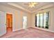 Large bedroom with neutral walls, walk-in closet, and ensuite access to the bathroom at 501 Painted Duck Ct., Myrtle Beach, SC 29588