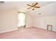 The spacious bedroom features a window with green curtains and a ceiling fan at 501 Painted Duck Ct., Myrtle Beach, SC 29588