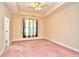 Spacious bedroom with neutral walls, tray ceiling, and a ceiling fan at 501 Painted Duck Ct., Myrtle Beach, SC 29588