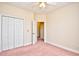 A standard bedroom contains a ceiling fan and doors leading to a closet at 501 Painted Duck Ct., Myrtle Beach, SC 29588
