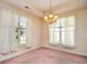 Bright dining room featuring a chandelier and abundant natural light from large windows at 501 Painted Duck Ct., Myrtle Beach, SC 29588