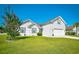 Charming two-story home with white siding, well-manicured lawn, and attached two-car garage at 501 Painted Duck Ct., Myrtle Beach, SC 29588