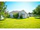 Beautifully landscaped single-story home with manicured lawn and blooming shrubs at 501 Painted Duck Ct., Myrtle Beach, SC 29588