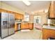 Bright kitchen with stainless steel appliances, tile backsplash, and tile flooring at 501 Painted Duck Ct., Myrtle Beach, SC 29588