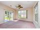 Living room with a sliding door to the outside patio and a large window at 501 Painted Duck Ct., Myrtle Beach, SC 29588