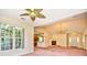 Spacious living room with fireplace, large windows, and view of the kitchen and front entryway at 501 Painted Duck Ct., Myrtle Beach, SC 29588