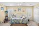 Sunny bedroom with a comfortable bed, bright windows, and cozy decor accents at 509 June Bug Ct., Myrtle Beach, SC 29588