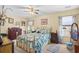 Inviting bedroom featuring a floral bedspread, matching nightstands, and natural lighting at 509 June Bug Ct., Myrtle Beach, SC 29588
