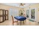 Cozy breakfast nook with tile flooring, shutters, and a charming dining set with outdoor access at 509 June Bug Ct., Myrtle Beach, SC 29588