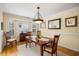 Inviting dining room featuring hardwood floors, neutral walls, and elegant decor with ample natural light at 509 June Bug Ct., Myrtle Beach, SC 29588