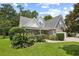 Charming two-story home featuring brick accents, a lush front yard, and manicured landscaping at 509 June Bug Ct., Myrtle Beach, SC 29588