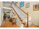 Inviting foyer with staircase, hardwood floors, natural light, and tasteful decor at 509 June Bug Ct., Myrtle Beach, SC 29588