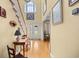 Bright foyer featuring hardwood floors, high ceilings, a staircase, and natural light at 509 June Bug Ct., Myrtle Beach, SC 29588