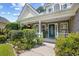 Inviting front porch with brick accents, lovely landscaping, and a charming entrance at 509 June Bug Ct., Myrtle Beach, SC 29588