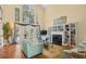 Spacious living room with tall windows, hardwood floors, fireplace and built-in bookshelves at 509 June Bug Ct., Myrtle Beach, SC 29588