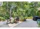 Outdoor patio featuring a table set, landscaping, and grill, perfect for entertaining or relaxation at 509 June Bug Ct., Myrtle Beach, SC 29588