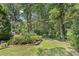 Beautifully landscaped yard with mature trees, offering a serene and private outdoor space at 509 June Bug Ct., Myrtle Beach, SC 29588
