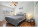 Comfortable bedroom showcases a ceiling fan and calming coastal-inspired artwork at 510 Fairwood Lakes Dr. # R-17, Myrtle Beach, SC 29588