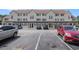 Condominium complex with ample parking spaces on a sunny day, offering convenient access for residents and visitors at 510 Fairwood Lakes Dr. # R-17, Myrtle Beach, SC 29588