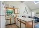 Cozy kitchen features white cabinets, light countertops, and beach-themed decor at 510 Fairwood Lakes Dr. # R-17, Myrtle Beach, SC 29588