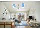 Sunlit open-concept living area boasting vaulted ceilings, skylights, and a walk-out to the balcony at 510 Fairwood Lakes Dr. # R-17, Myrtle Beach, SC 29588