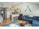 Open-concept living space offers a blend of style with a vaulted ceiling, kitchen, and a cozy seating area at 510 Fairwood Lakes Dr. # R-17, Myrtle Beach, SC 29588