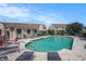Community pool surrounded by lounge chairs, tables, and a bath house on a sunny day at 510 Fairwood Lakes Dr. # R-17, Myrtle Beach, SC 29588