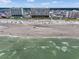 Expansive aerial view of a beachfront property with a sandy beach and ocean waves at 5404 N Ocean Blvd. # 11-D, North Myrtle Beach, SC 29582