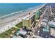 A high-rise complex stands on the beach near a coastal street and a residential area at 5404 N Ocean Blvd. # 11-D, North Myrtle Beach, SC 29582