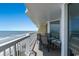 Relaxing balcony area with seating and breathtaking ocean views, perfect for enjoying the coastal breeze at 5404 N Ocean Blvd. # 11-D, North Myrtle Beach, SC 29582