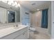 Bathroom with tub and shower combination plus large vanity with white cabinets at 5404 N Ocean Blvd. # 11-D, North Myrtle Beach, SC 29582