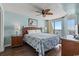 Serene bedroom featuring a comfortable bed, ocean view, and sliding door access to the balcony at 5404 N Ocean Blvd. # 11-D, North Myrtle Beach, SC 29582