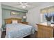 Cozy bedroom with ceiling fan, queen bed and woven furnishings at 5404 N Ocean Blvd. # 11-D, North Myrtle Beach, SC 29582