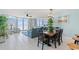 Charming dining area featuring a stylish table set and large windows offering scenic ocean views at 5404 N Ocean Blvd. # 11-D, North Myrtle Beach, SC 29582