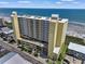 Stunning exterior view of a condo building with ocean views and beach access at 5404 N Ocean Blvd. # 11-D, North Myrtle Beach, SC 29582