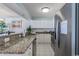 Modern kitchen with granite countertops and stainless steel appliances at 5404 N Ocean Blvd. # 11-D, North Myrtle Beach, SC 29582
