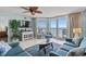 Inviting living room with comfortable seating, stylish decor, and a large sliding glass door to the balcony at 5404 N Ocean Blvd. # 11-D, North Myrtle Beach, SC 29582