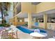 Outdoor pool area with tables, chairs, and pool rules at 5404 N Ocean Blvd. # 11-D, North Myrtle Beach, SC 29582