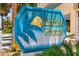 A sign of Sunrise Pointe with a palm tree at 5404 N Ocean Blvd. # 11-D, North Myrtle Beach, SC 29582